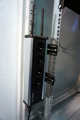 A metal bracket to fasten one NETIO 4 or NETIO 4All device to a vertical bar in a rack frame